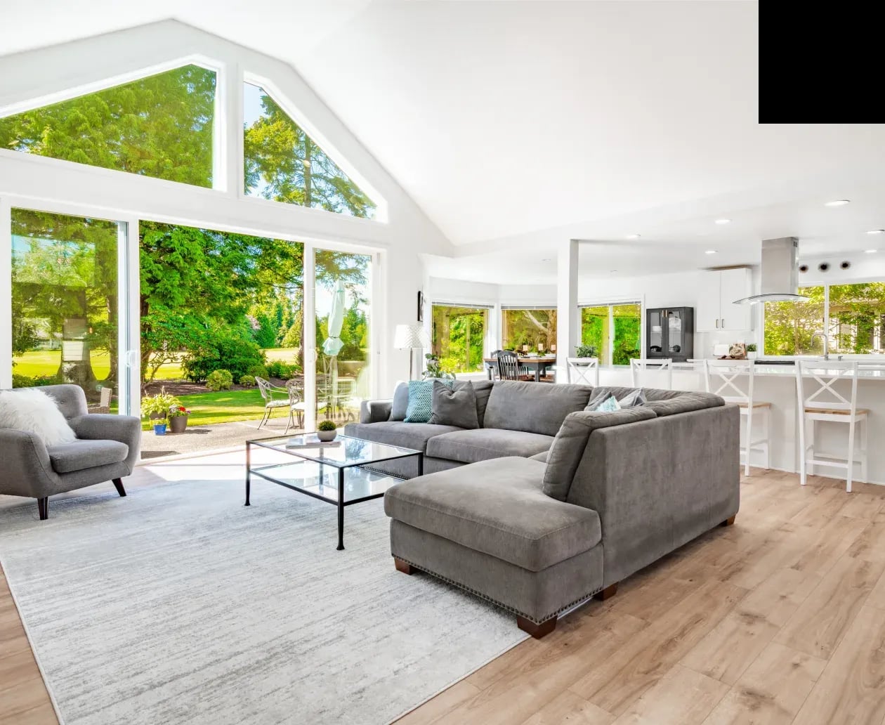 Bright residential living room with large impact windows