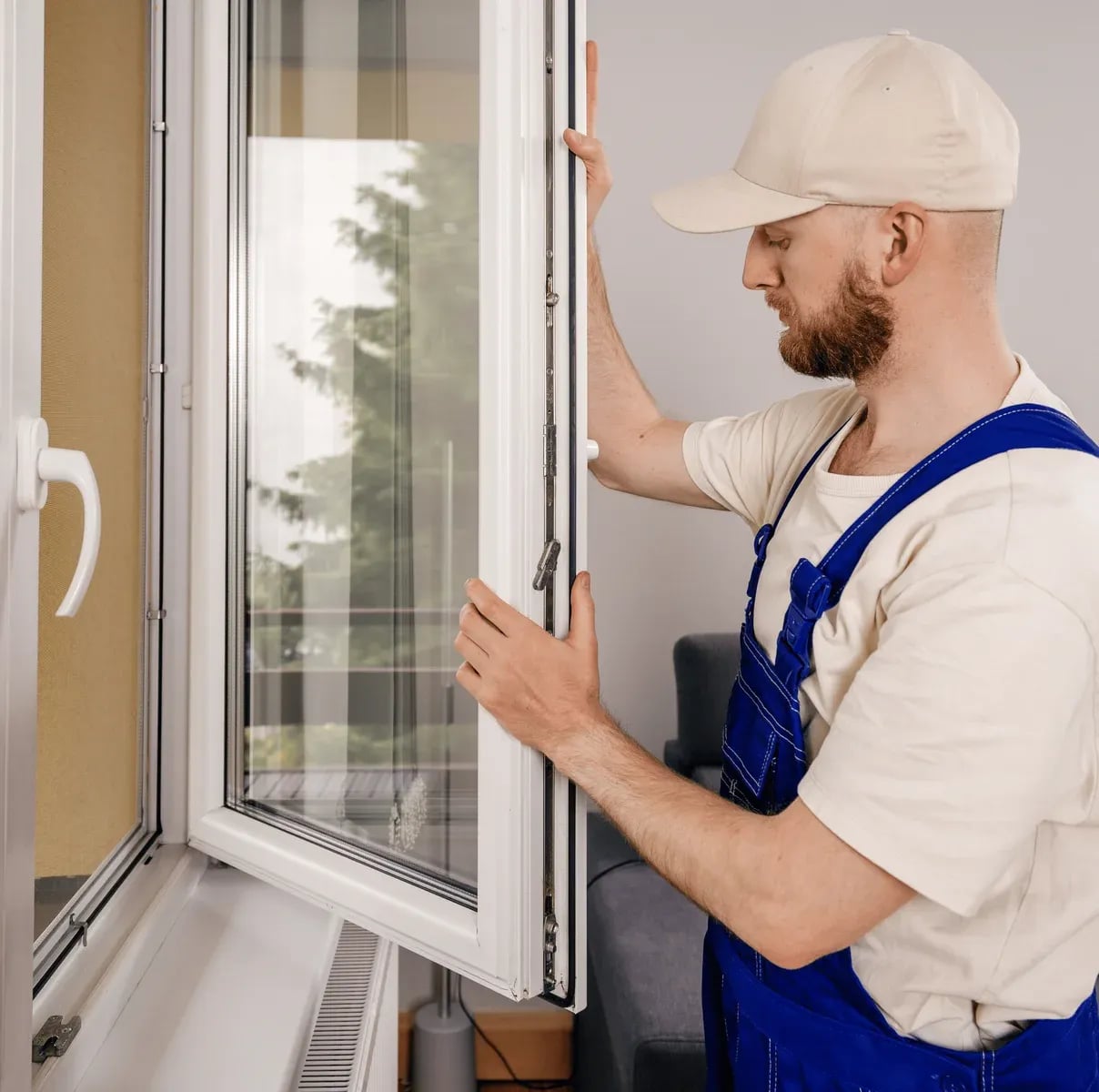 Repairman carefully servicing an impact glass window