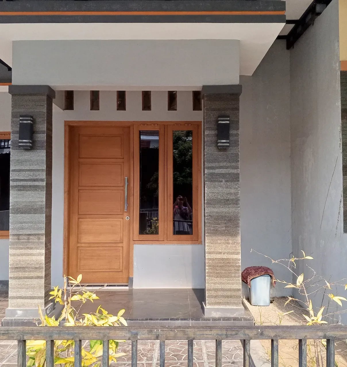 Modern house facade with a wooden front door